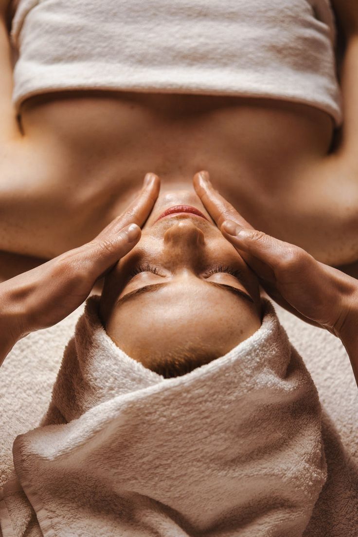Client with fresh, radiant skin after a corrective facial treatment